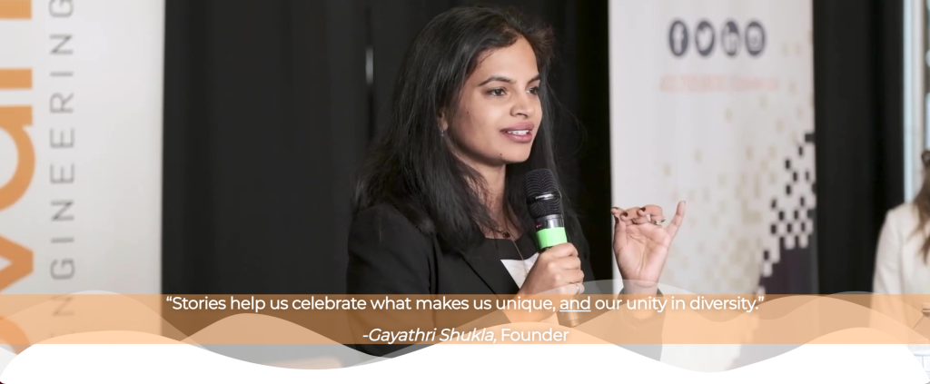 Gayathri holding a mic and looking at an audience. There is a quote on the image that says "Stories help us celebrate what makes us unique, and our unity in diversity." - Gayathri Shukla, Founder
